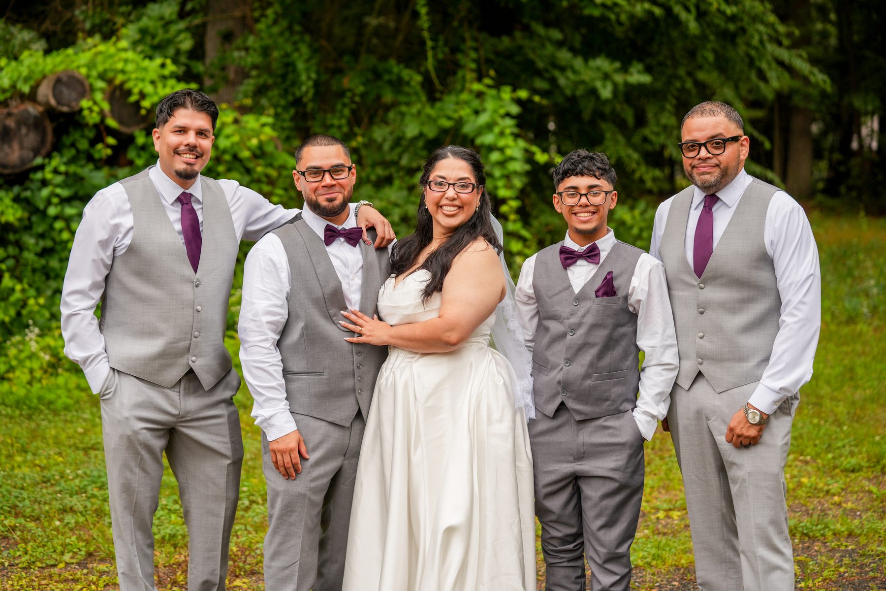 Bride with the groom and groomsmen in gray suits at a Western Massachusetts wedding
