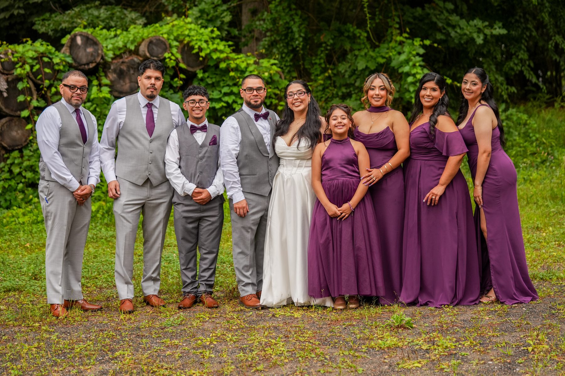 Full wedding party with bride, groom, bridesmaids in purple and groomsmen in Western Massachusetts