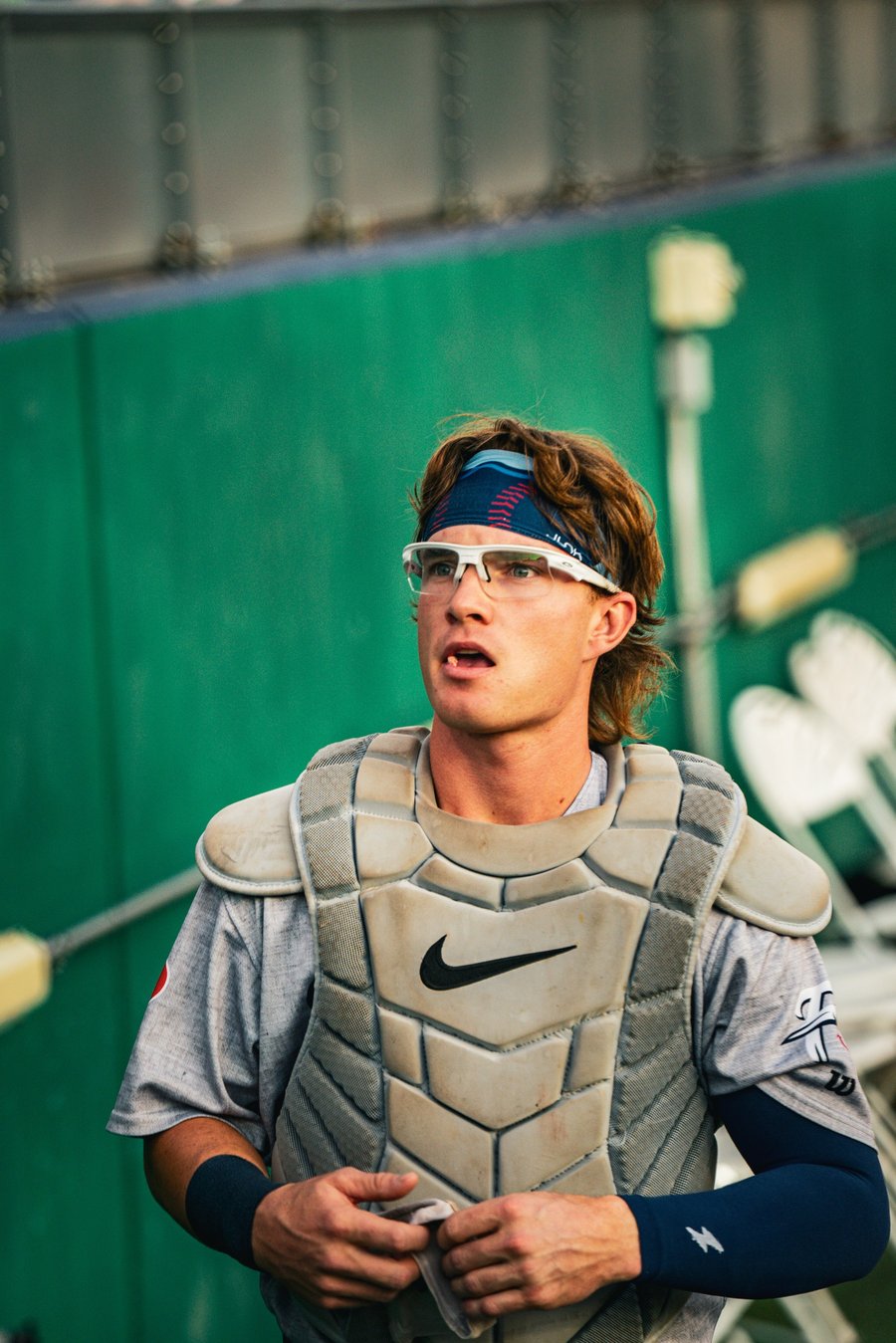 Portrait of a baseball catcher in gear behind the mask