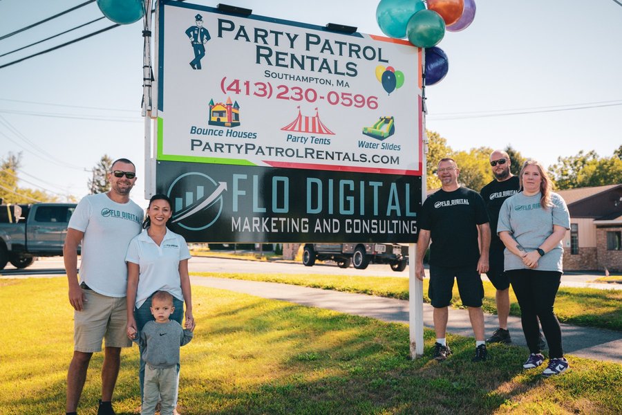 Group photo at a business grand opening in Western Massachusetts
