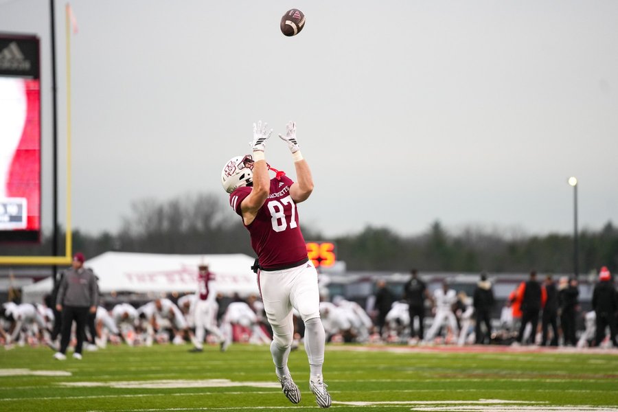 Football player making a catch during a game in Massachusetts