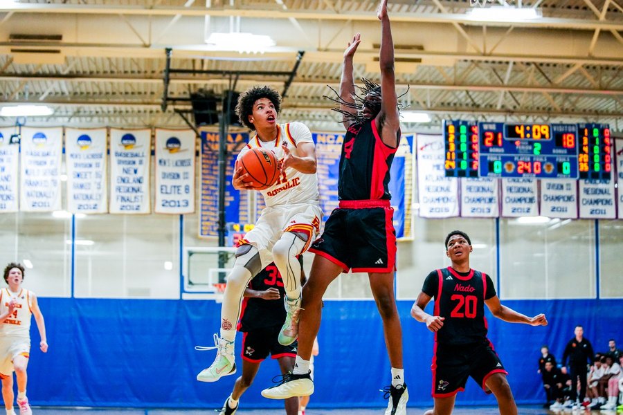 High school basketball player driving to the basket at the Hoophall Classic in Springfield, Massachusetts