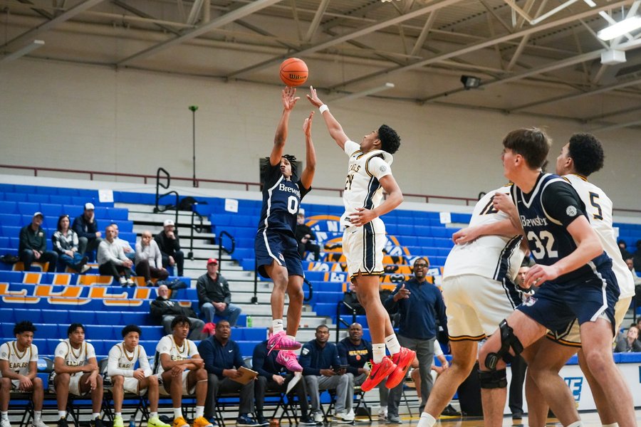 Basketball player rising for a jump shot during a Hoophall Classic game