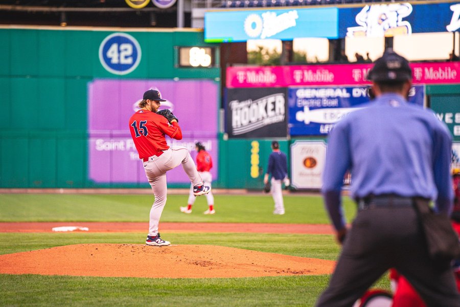 Baseball pitcher in his windup at a professional ballpark in Hartford, Connecticut