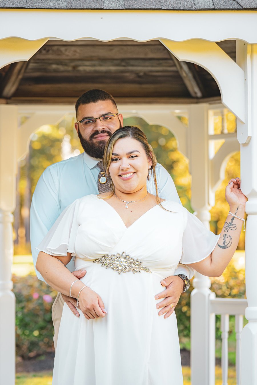 Newlyweds posing for a wedding portrait at a gazebo in Western Massachusetts